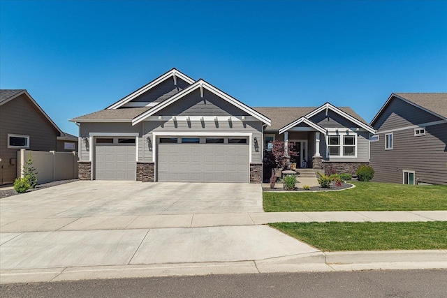 1616 S Morningside Heights Dr, Greenacres, WA 99016 - craftsman-style house with stone siding, a garage, and concrete driveway