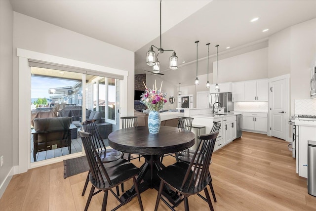 1616 S Morningside Heights Dr, Greenacres, WA 99016 - dining space featuring a high ceiling, light wood finished floors, a chandelier, and recessed lighting