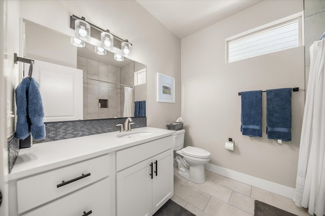 1616 S Morningside Heights Dr, Greenacres, WA 99016 - bathroom with vanity, toilet, tiled shower, tile patterned floors, and baseboards