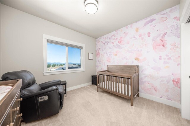 1616 S Morningside Heights Dr, Greenacres, WA 99016 - bedroom featuring wallpapered walls, baseboards, light colored carpet, and a crib