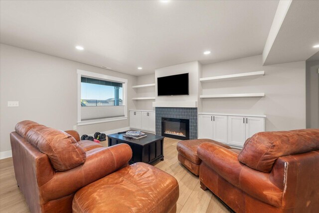 1616 S Morningside Heights Dr, Greenacres, WA 99016 - living area with light wood-style flooring, a tiled fireplace, recessed lighting, and baseboards