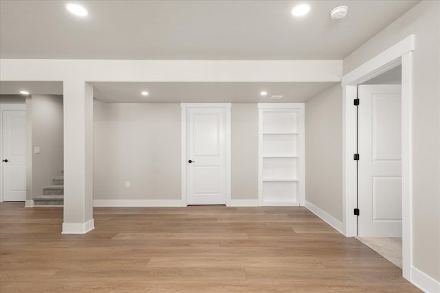 1616 S Morningside Heights Dr, Greenacres, WA 99016 - below grade area featuring recessed lighting, baseboards, built in shelves, and light wood-type flooring