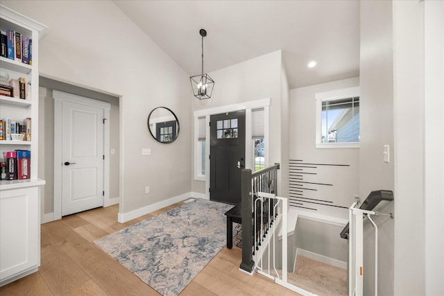 1616 S Morningside Heights Dr, Greenacres, WA 99016 - entrance foyer featuring light wood-style flooring, a chandelier, lofted ceiling, and baseboards