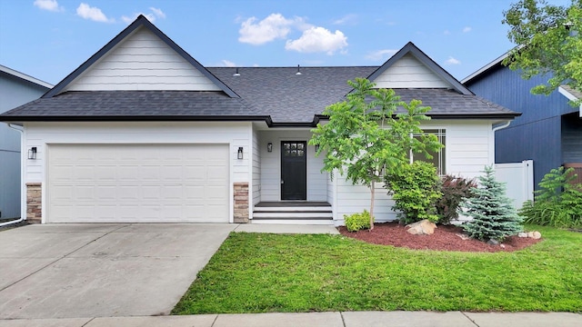 415 S Mckee St, Spokane Valley, WA 99016 - view of front of property with roof with shingles, a front yard, driveway, and a garage