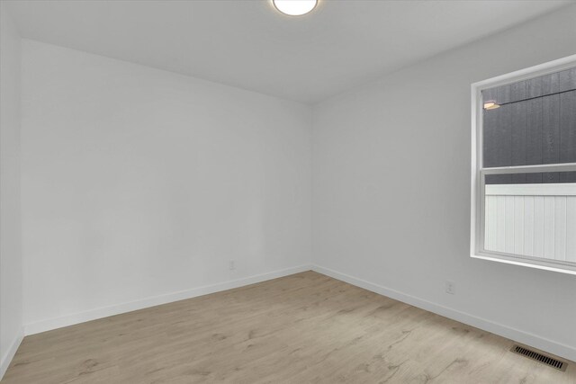415 S Mckee St, Spokane Valley, WA 99016 - empty room featuring light wood-style flooring and baseboards