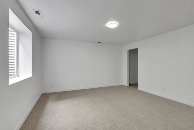 415 S Mckee St, Spokane Valley, WA 99016 - unfurnished room featuring light colored carpet, plenty of natural light, and baseboards
