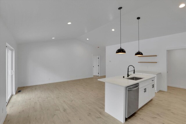 415 S Mckee St, Spokane Valley, WA 99016 - kitchen featuring stainless steel dishwasher, a sink, lofted ceiling, white cabinets, and light wood-style floors