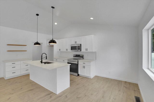 415 S Mckee St, Spokane Valley, WA 99016 - kitchen with appliances with stainless steel finishes, a sink, open shelves, decorative backsplash, and white cabinets