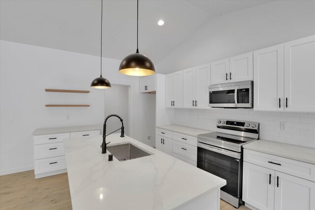 415 S Mckee St, Spokane Valley, WA 99016 - kitchen with appliances with stainless steel finishes, a sink, open shelves, tasteful backsplash, and white cabinets