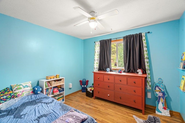 3225 E 16th Ave, Spokane, WA 99223 - bedroom with light wood-style flooring, baseboards, and ceiling fan