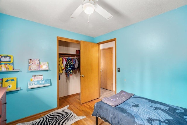 3225 E 16th Ave, Spokane, WA 99223 - bedroom with wood finished floors, a closet, baseboards, and a ceiling fan
