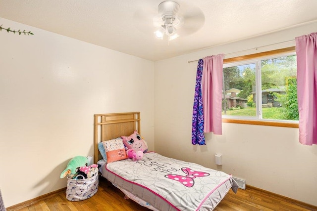 3225 E 16th Ave, Spokane, WA 99223 - bedroom with wood finished floors, baseboards, and a ceiling fan