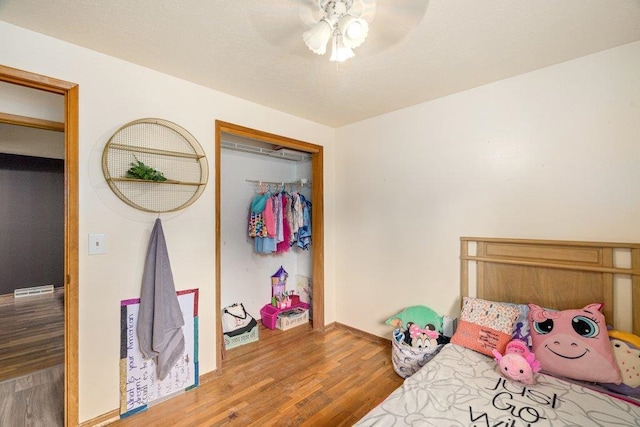 3225 E 16th Ave, Spokane, WA 99223 - bedroom featuring baseboards, wood finished floors, and ceiling fan