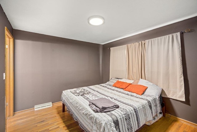 3225 E 16th Ave, Spokane, WA 99223 - bedroom featuring light wood-style floors and baseboards
