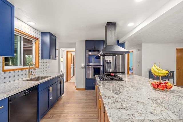 3225 E 16th Ave, Spokane, WA 99223 - kitchen featuring stainless steel appliances, a sink, island range hood, light wood-style floors, and blue cabinetry