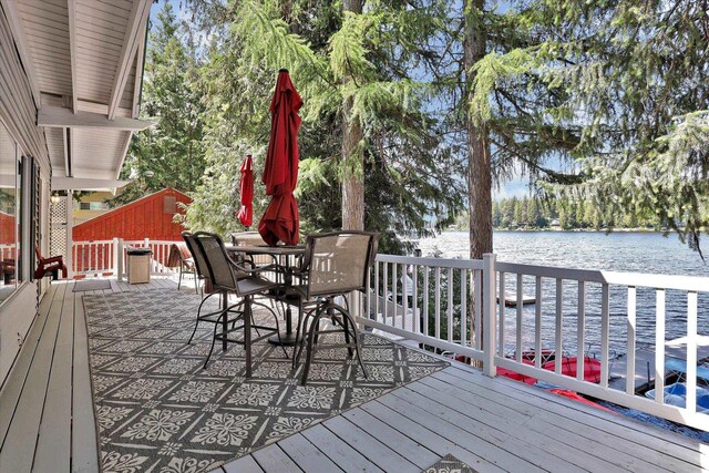491 Eastshore Rd, Newport, WA 99156 - wooden terrace featuring a water view and outdoor dining space