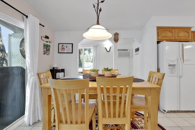 491 Eastshore Rd, Newport, WA 99156 - dining room with light tile patterned floors and a wall unit AC