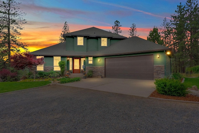 6533 D Lois Way, Nine Mile Falls, WA 99026 - view of front facade featuring stone siding, a garage, and concrete driveway