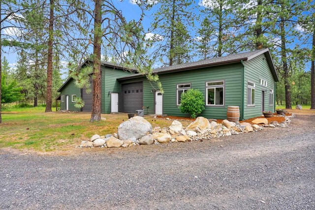 6533 D Lois Way, Nine Mile Falls, WA 99026 - view of front facade with a garage and driveway