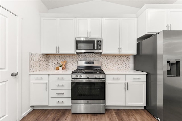 3105 N Rio Grande Rd, Spokane Valley, WA 99027 - kitchen featuring stainless steel appliances, lofted ceiling, light countertops, dark wood-style flooring, and decorative backsplash