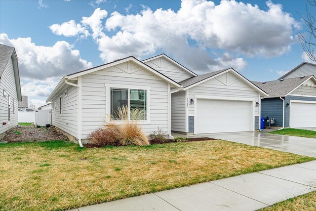 3105 N Rio Grande Rd, Spokane Valley, WA 99027 - ranch-style house with a garage, concrete driveway, and a front lawn