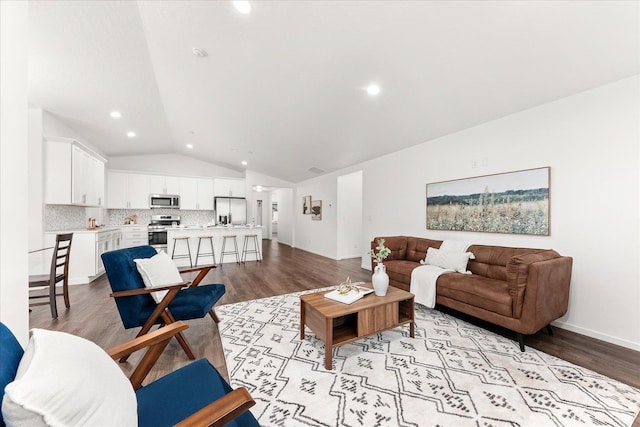 3105 N Rio Grande Rd, Spokane Valley, WA 99027 - living room featuring vaulted ceiling, wood finished floors, baseboards, and recessed lighting