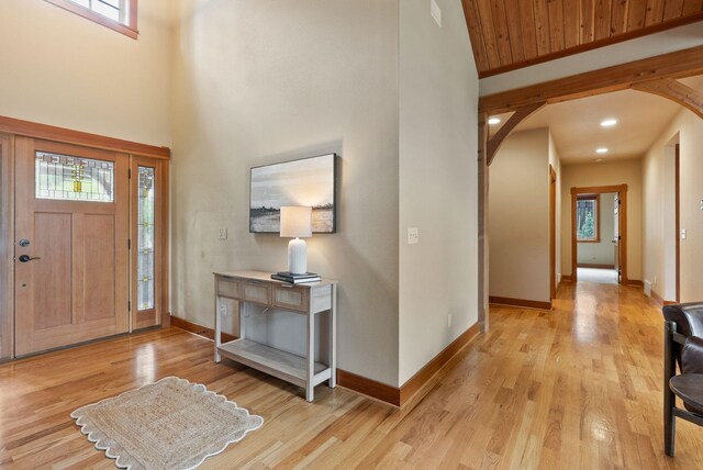 1122 E Hangman Ln, Spokane, WA 99224 - foyer featuring arched walkways, healthy amount of natural light, light wood-type flooring, baseboards, and a towering ceiling