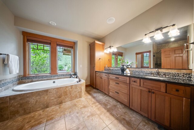 1122 E Hangman Ln, Spokane, WA 99224 - bathroom with double vanity, a garden tub, a stall shower, and lofted ceiling