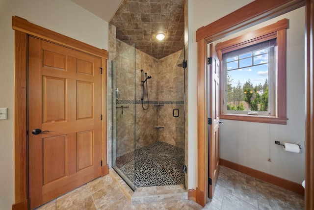 1122 E Hangman Ln, Spokane, WA 99224 - full bathroom with a shower stall and baseboards