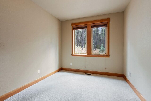 1122 E Hangman Ln, Spokane, WA 99224 - empty room with light carpet and baseboards