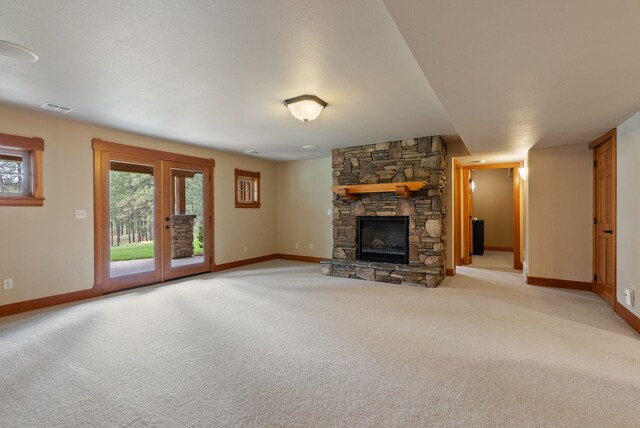 1122 E Hangman Ln, Spokane, WA 99224 - unfurnished living room with baseboards, light carpet, and a fireplace