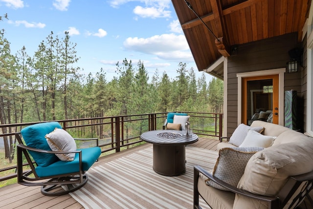 1122 E Hangman Ln, Spokane, WA 99224 - deck with a fire pit and a wooded view