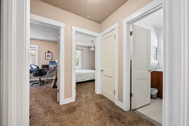 3507 E 28th Ave, Spokane, WA 99223 - hall with carpet flooring, an office area, and a textured ceiling