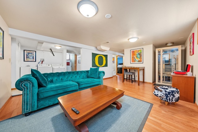 3507 E 28th Ave, Spokane, WA 99223 - living room with independent washer and dryer, wood finished floors, and baseboards