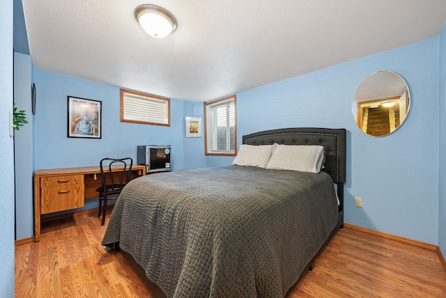 3507 E 28th Ave, Spokane, WA 99223 - bedroom with light wood-type flooring and baseboards