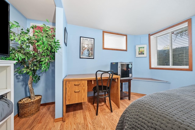 3507 E 28th Ave, Spokane, WA 99223 - bedroom featuring light wood finished floors, an office area, and baseboards