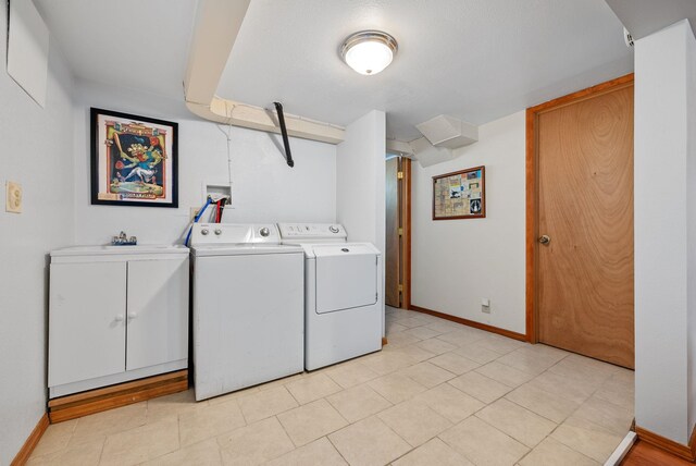 3507 E 28th Ave, Spokane, WA 99223 - laundry room featuring cabinet space, washing machine and dryer, and baseboards