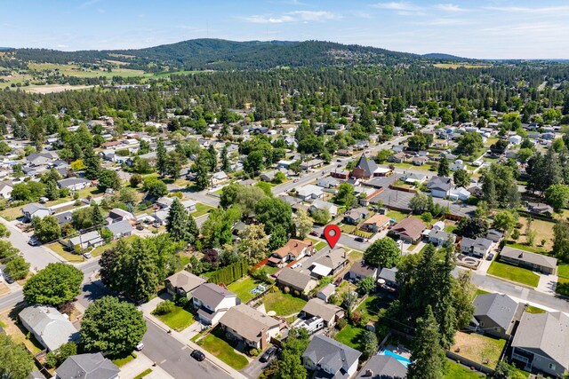 3507 E 28th Ave, Spokane, WA 99223 - aerial view of residential area featuring a heavily wooded area and mountains