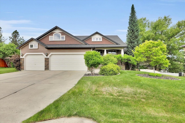 903 E Harding Ct, Spokane, WA 99218 - craftsman inspired home featuring concrete driveway, an attached garage, and stone siding