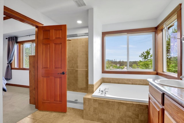 903 E Harding Ct, Spokane, WA 99218 - full bathroom with a bath, a stall shower, tile patterned flooring, and vanity
