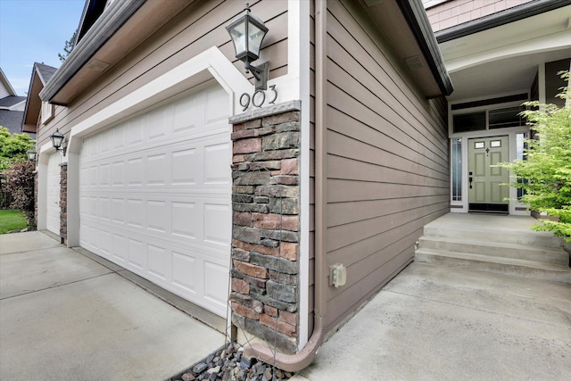 903 E Harding Ct, Spokane, WA 99218 - garage featuring concrete driveway