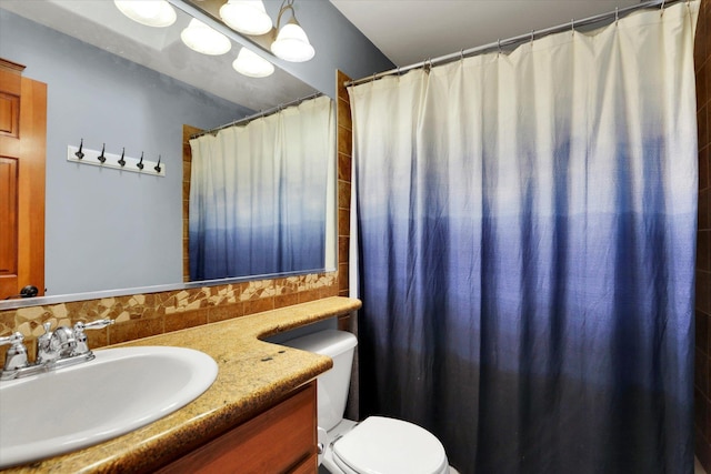 903 E Harding Ct, Spokane, WA 99218 - full bath with toilet, vanity, backsplash, and curtained shower