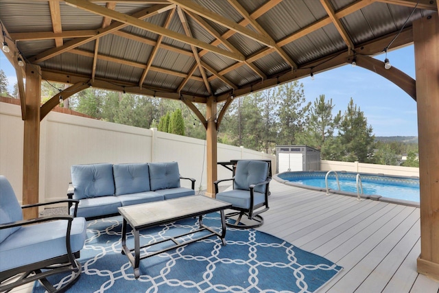 903 E Harding Ct, Spokane, WA 99218 - wooden terrace featuring an outdoor living space, a fenced backyard, and a gazebo