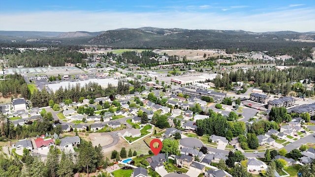 903 E Harding Ct, Spokane, WA 99218 - aerial view of property's location featuring a mountainous background and nearby suburban area