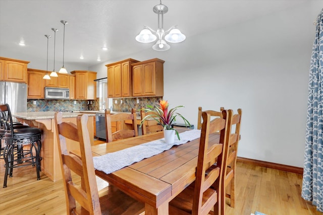903 E Harding Ct, Spokane, WA 99218 - dining area featuring light wood-type flooring, a chandelier, baseboards, and recessed lighting