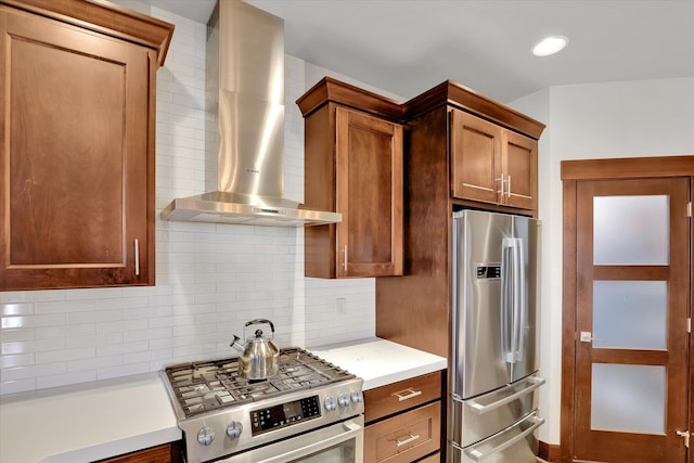 4523 S Henrys Fork Ln, Spokane, WA 99206 - kitchen with appliances with stainless steel finishes, wall chimney range hood, light countertops, and decorative backsplash