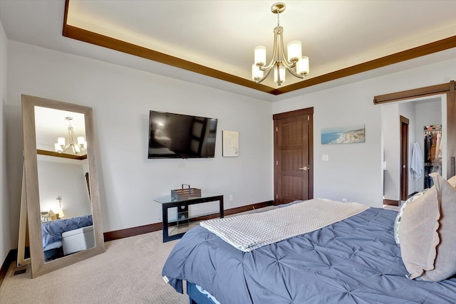 4523 S Henrys Fork Ln, Spokane, WA 99206 - carpeted bedroom with a chandelier, a barn door, and a tray ceiling