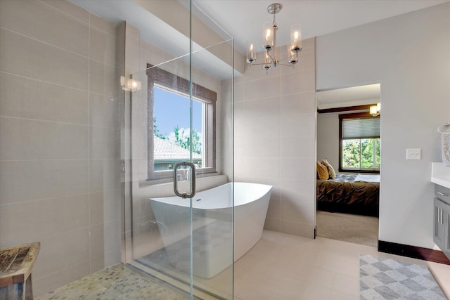 4523 S Henrys Fork Ln, Spokane, WA 99206 - bathroom featuring a chandelier, a freestanding bath, vanity, tiled shower, and connected bathroom