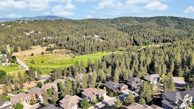 4523 S Henrys Fork Ln, Spokane, WA 99206 - aerial view of residential area featuring a forest and a mountainous background