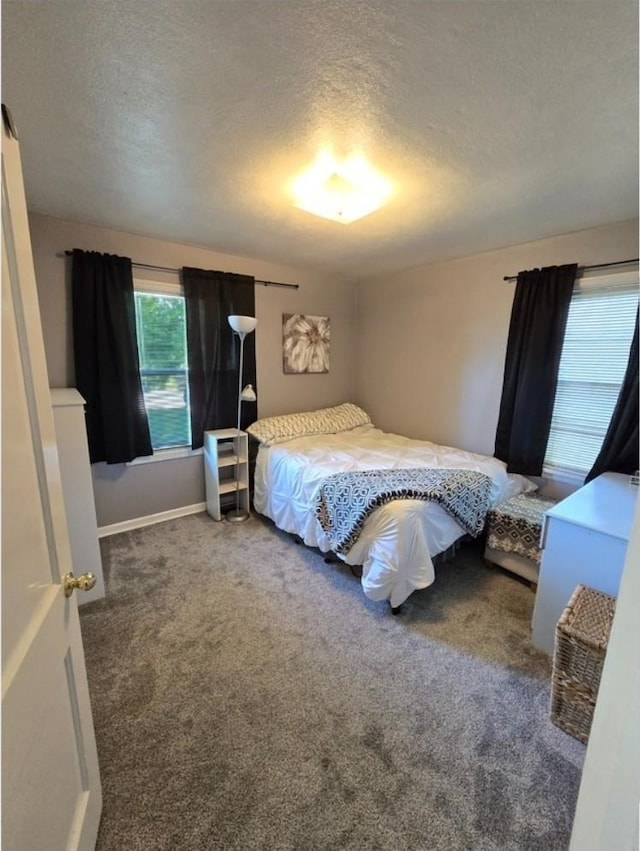 1117 E Garland Ave, Spokane, WA 99207 - carpeted bedroom featuring a textured ceiling and baseboards